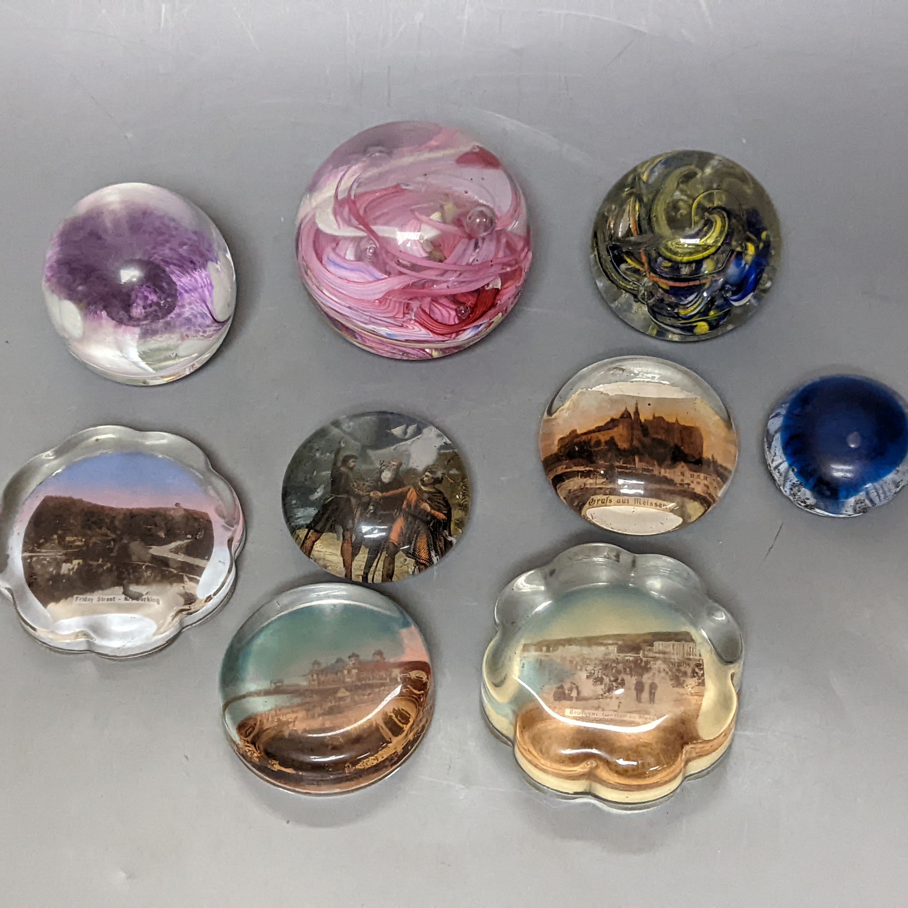 Nine various glass paperweights